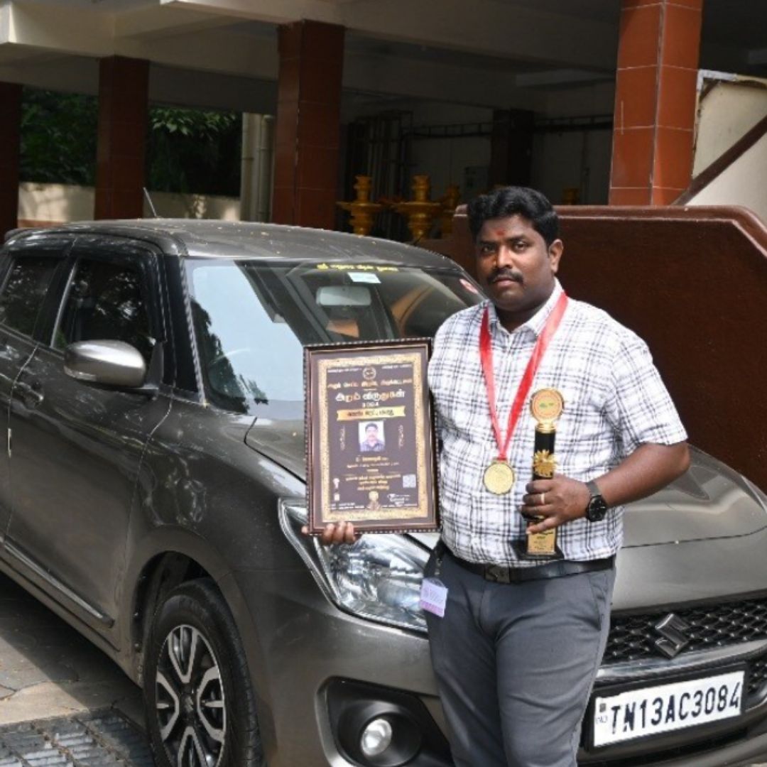 Lucky Home Health Care founder, Mr. Meganathan D, on stage during an award ceremony in Chennai, celebrating achievements in senior care and nursing excellence.