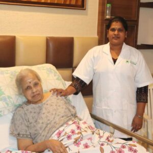 Doctor and nurse from Lucky Home Health Care coordinating patient care during a home visit in Chennai.