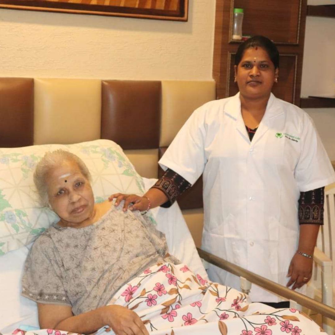 Doctor and nurse from Lucky Home Health Care coordinating patient care during a home visit in Chennai.