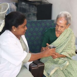 Nurse from Lucky Home Health Care comforting an elderly patient at home in Chennai with kindness and empathy.
